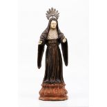 A SaintIndo-Portuguese sculpture Carved and painted wood Ivory face and hands Silver radiant halo