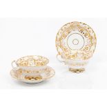 A pair of cups and saucersVista Alegre porcelain Foliage gilt decoration Marked to base Portugal,
