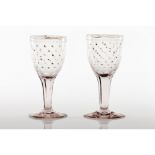 A pair of footed drinking glasses"La Granja" factory moulded glass Faceted shaft Gilt stars