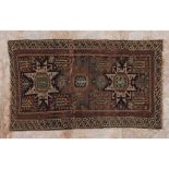 A shirwan rug, Russian wood and cotton Geometric design in shades of burgundy, green and blue (signs