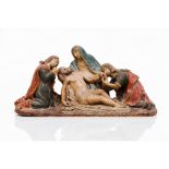 A PietaSculptural group depicting Christ on the Virgin Mary's arms, flanked by Mary Magdalene and