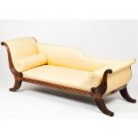 An Empire daybed in the regence styleMahogany Carved and striated decoration Textile upholstery