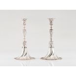 A pair of apron candle sticksPortuguese silver Spiralled decoration after 18th century prototype