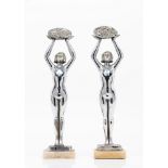 A pair of Art Deco style female figuresChrome metal Marble stands Signed "Limousin" (losses,