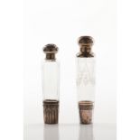 A set of two perfume bottles with stoppersGlass One of faceted decoration One of acid etched