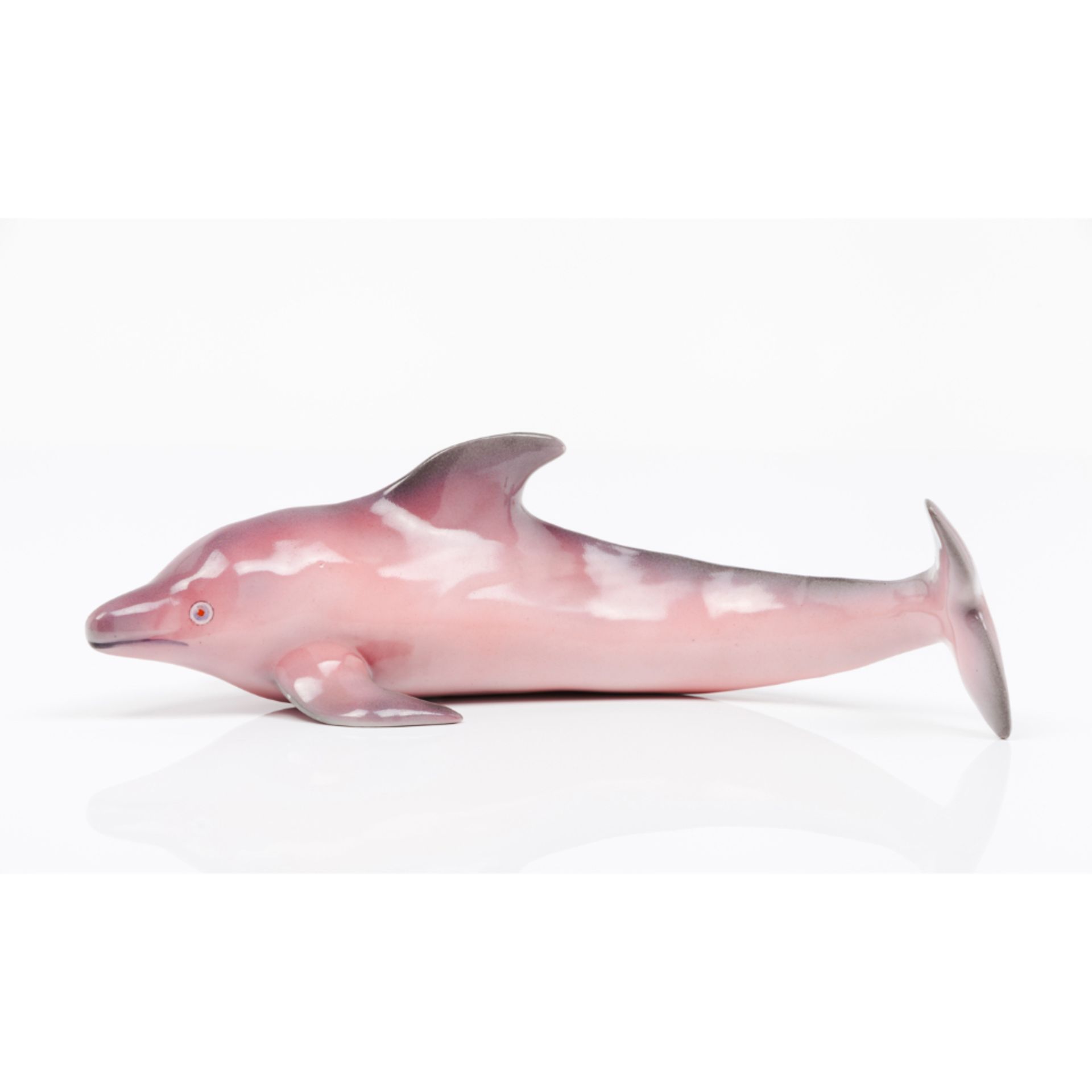 A dolphinVista Alegre porcelain Polychrome decoration Mark to base dated to 1924-47Length: 29,5cm