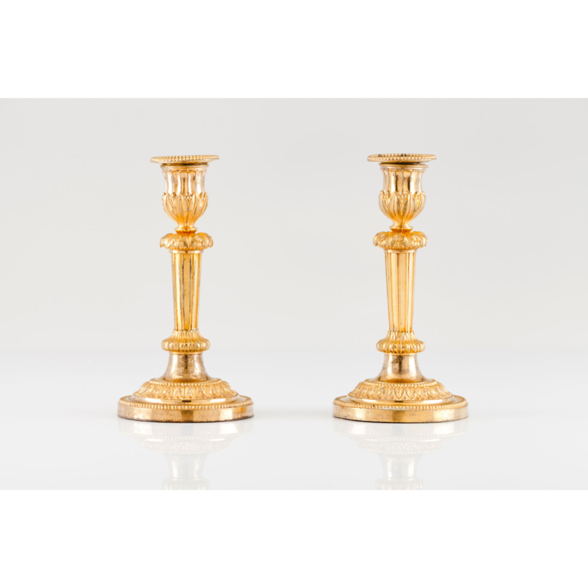 A pair of Louis XVI candlesticks