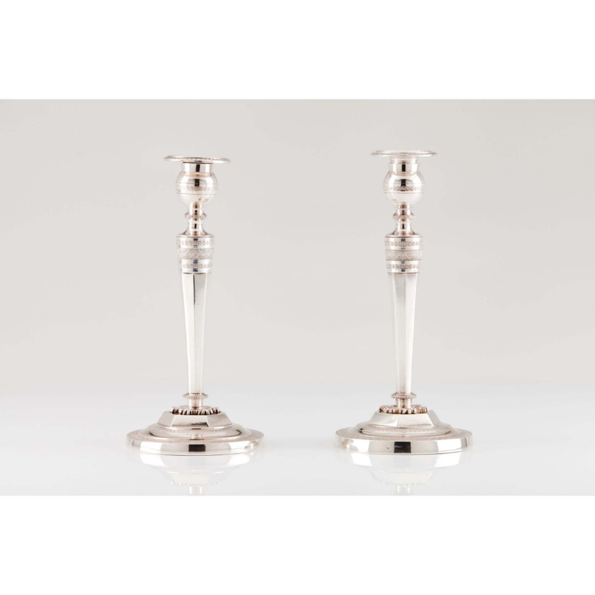 A pair of Consulate candlesticks