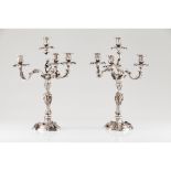 A pair of Rococo style four branch candelabra