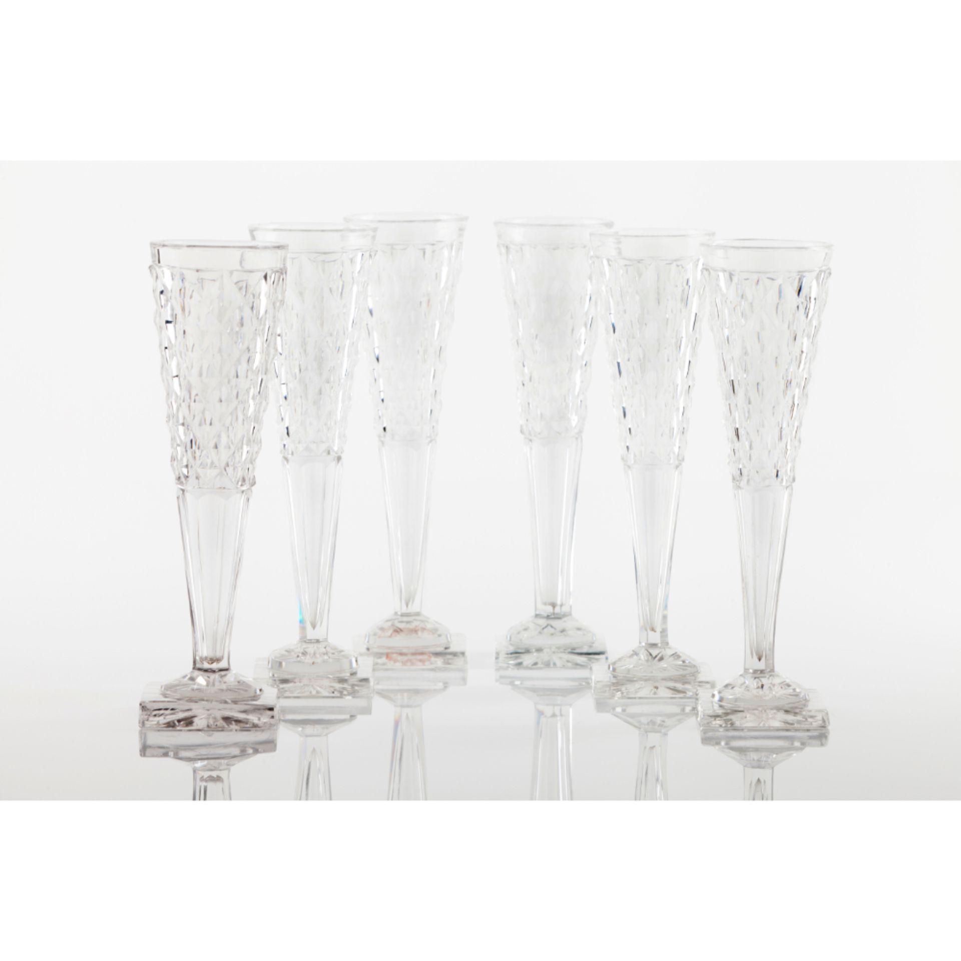 A set of 6 cut crystal champagne flutes