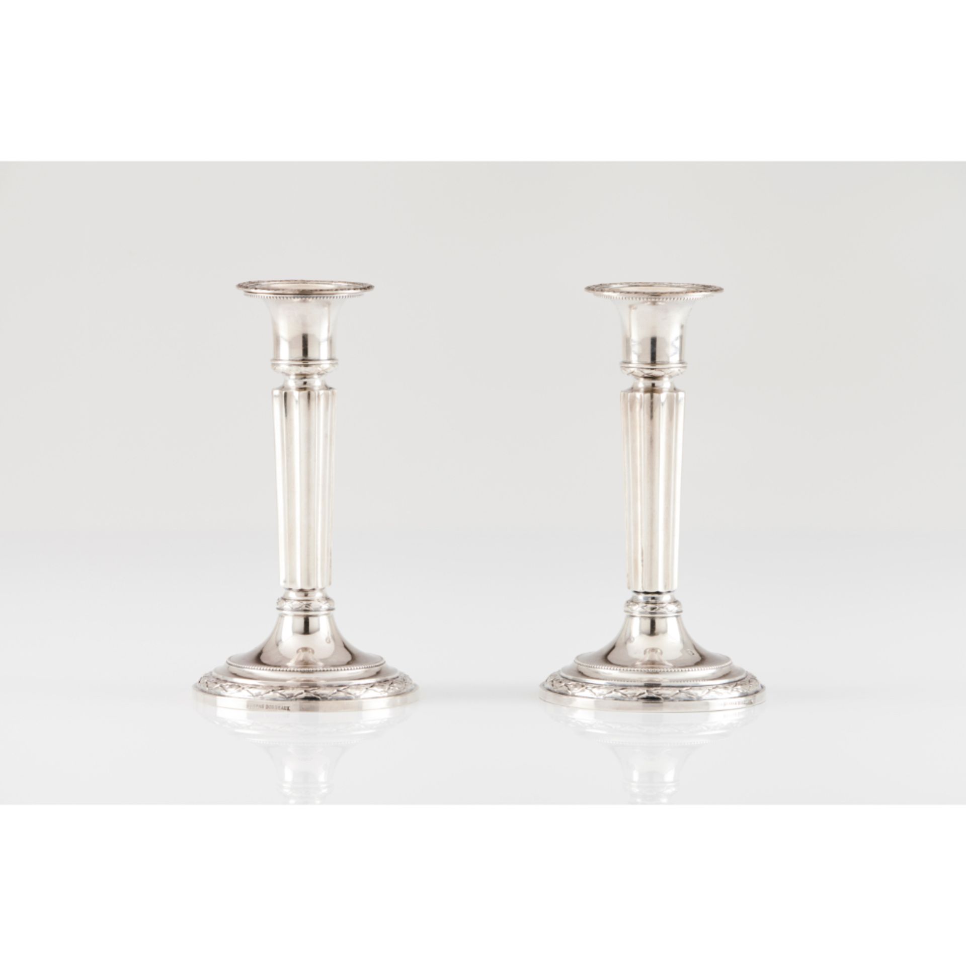 A pair of neoclassical candlesticks