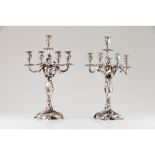 A pair of large Rocaille style five branch candelabra