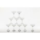 A set of 12 cut crystal Champagne glasses