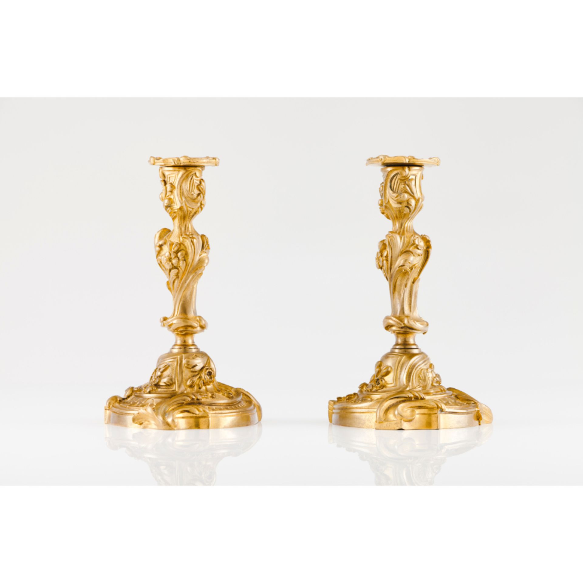 A pair of Rococo Louis XV period candlesticks