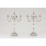 A pair of five branch candelabra