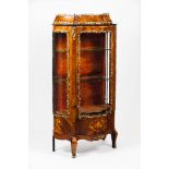 A Louis XVI style display cabinet