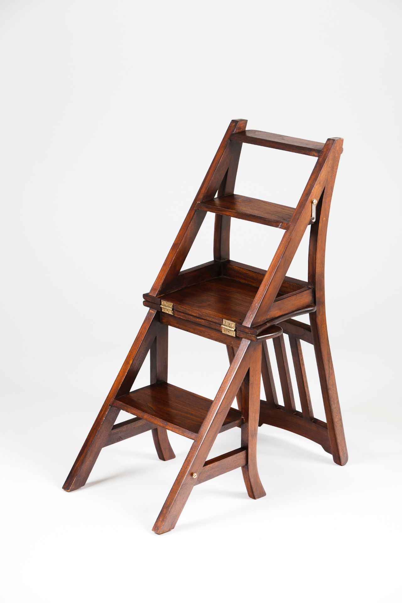 A metamorphic library chair / step ladder