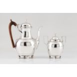 A sugar bowl and coffee pot