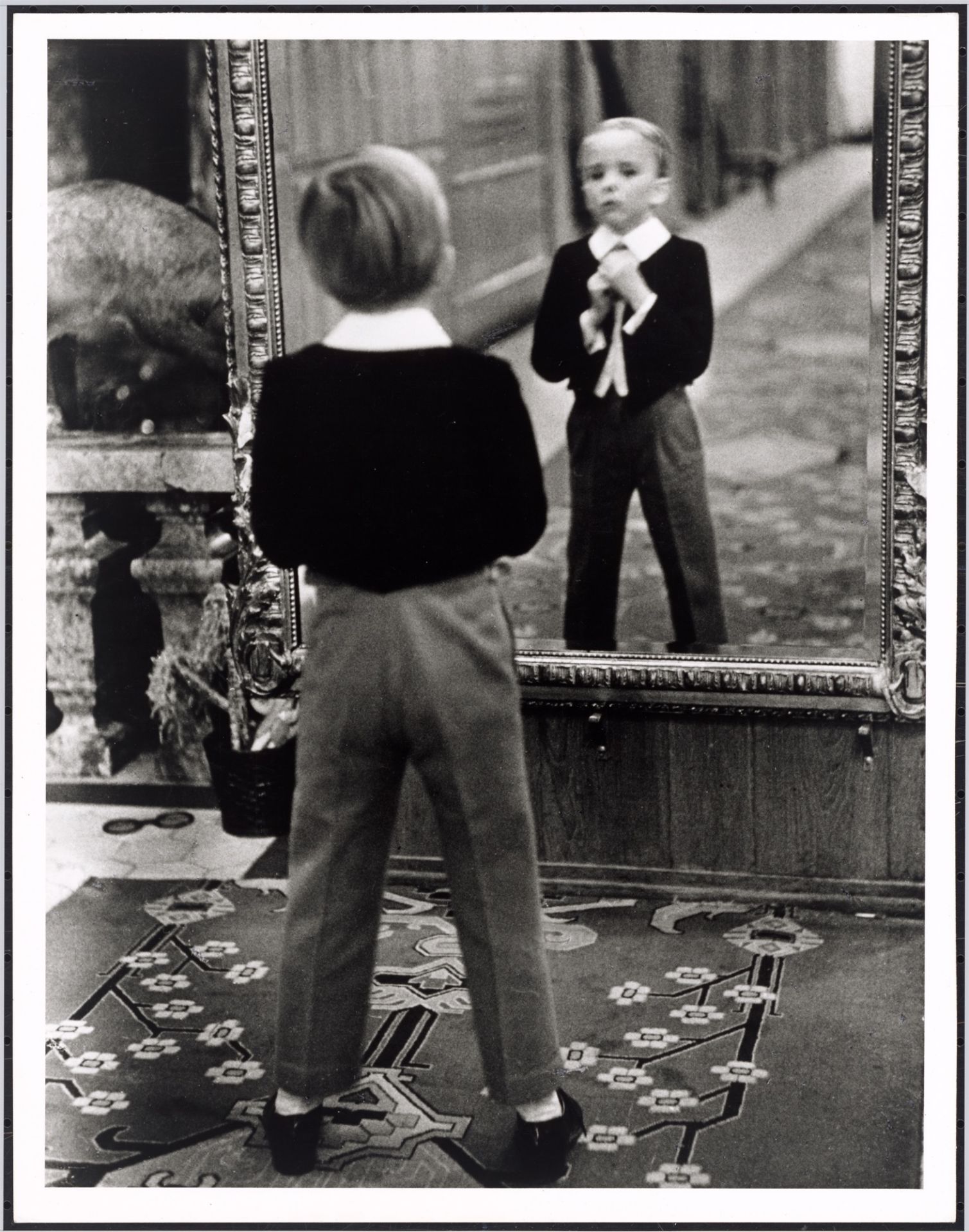 Alfred Eisenstaedt. ”Young English man looking in the mirror of the Grand Hotel in St. Moritz”. 1932 - Image 2 of 4