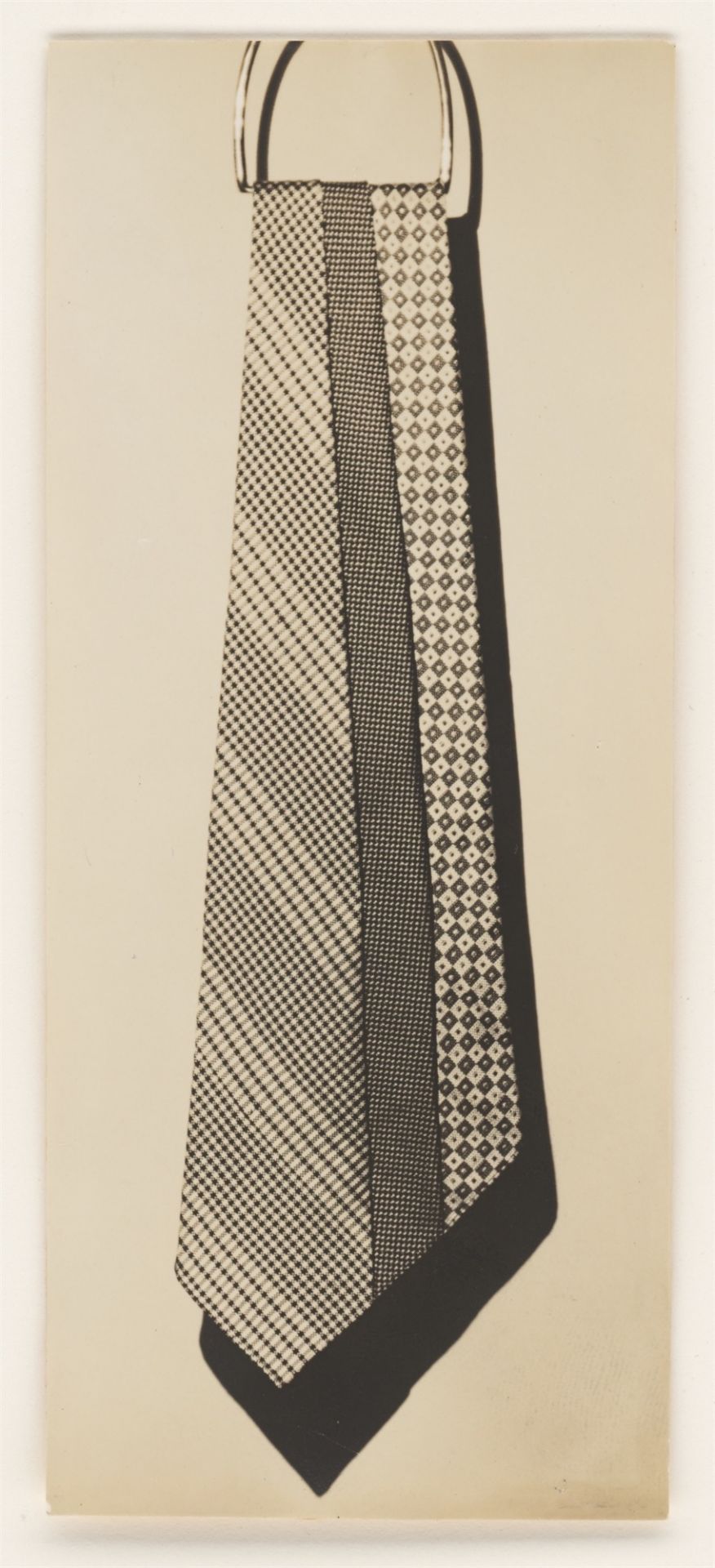 Paul Outerbridge Jr.. Untitled (Ties Hanging from Ring). Circa 1924/26 - Image 2 of 3