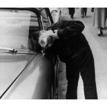 Leon Levinstein. Boy looking at Car mirror. 1958