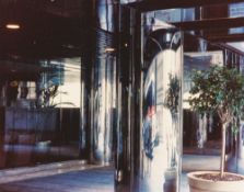 Dan Graham. ”Anamorphic stainless steel column - NYC office bldg.”. 2010