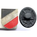 German WWII type helmet plate with mounting screws, and a WWI type black wound badge. P&P Group