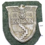German WWII type Kuban shield, mounted on fabric. P&P Group 1 (£14+VAT for the first lot and £1+