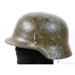 German WWII type Luftwaffe M40 helmet with remnants of snow camouflage paint. P&P Group 2 (£18+VAT