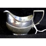 Small hallmarked silver jug, 44g. P&P Group 1 (£14+VAT for the first lot and £1+VAT for subsequent