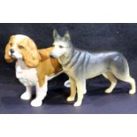 Two matte Beswick dogs, Alsatian H: 14 cm and King Charles Spaniel H: 13 cm. P&P group 2 (£18+ VAT