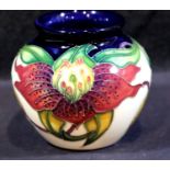 Moorcroft vase in the Anna Lily pattern, H: 7.5 cm. P&P Group 1 (£14+VAT for the first lot and £1+