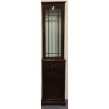 Narrow Edwardian mahogany display cabinet with cupboard and drawer below. Not available for in-house