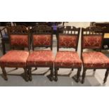 Four decorative carved oak framed and upholstered antique dining chairs. Not available for in-