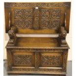 Antique drop top monks bench with carved back, lion arm rests and storage chest base, 105 x 50 x