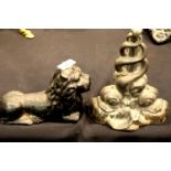 Two Victorian black painted cast iron doorstops, one in the form of a recumbent lion. P&P Group