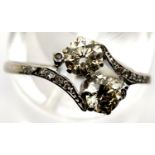 Vintage 1920s 18ct white gold diamond engagement ring, the crossover set champagne coloured stones