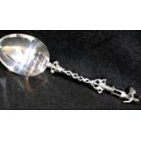 Continental silver ornate spoon with figural terminal, 54g. P&P Group 1 (£14+VAT for the first lot
