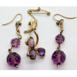 Presumed 9ct gold flower brooch with amethyst stones and safety chain and matching drop earrings.