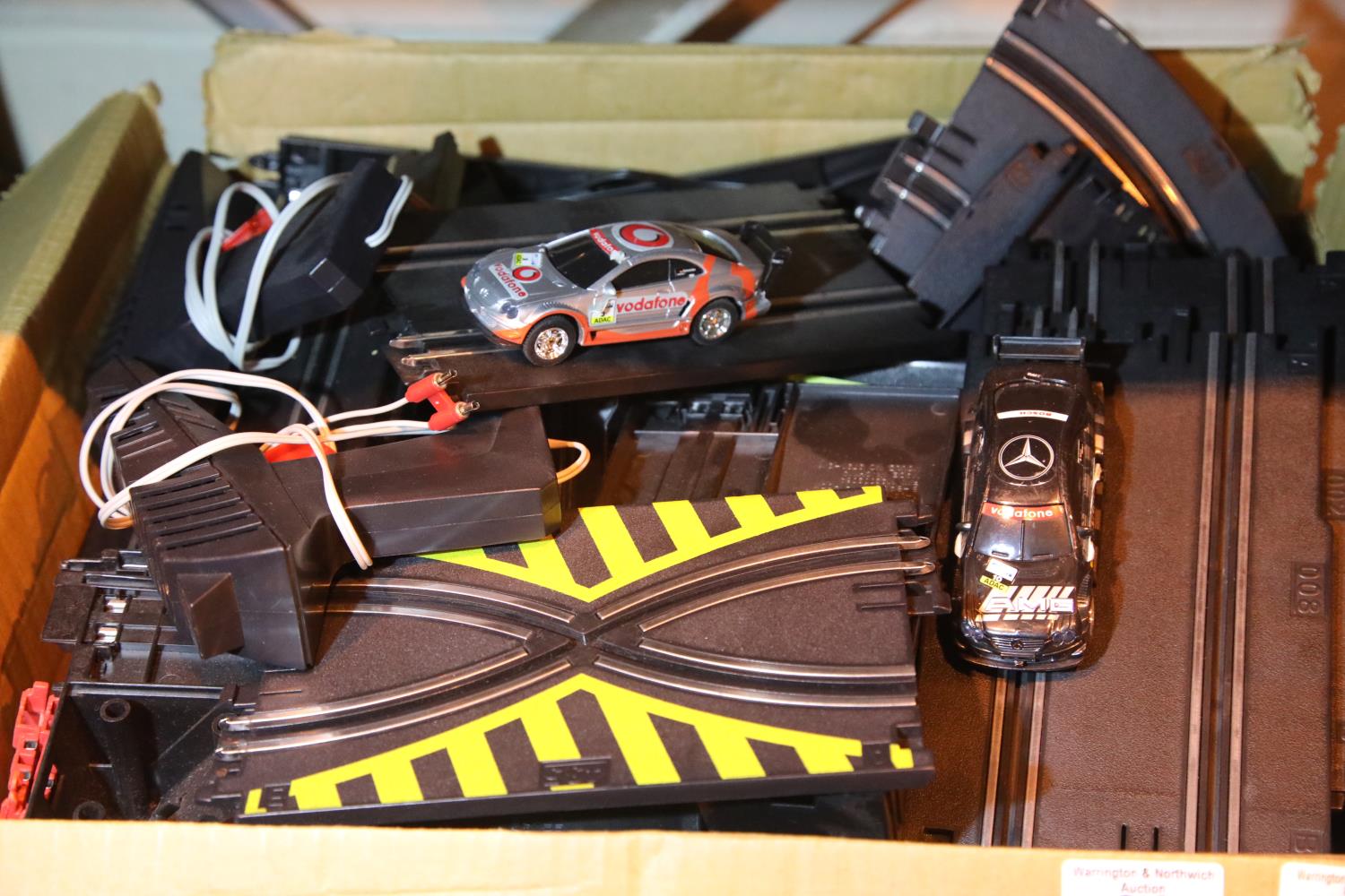 Slot car track with two cars and controllers. Not available for in-house P&P