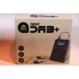 Pocket DAB+ radio with earphone, inbuilt rechargeable battery, has an auto adjusting clock, boxed.