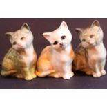 Three cat figurines including two Beswick and Royal Doulton. Not available for in-house P&P