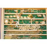 Jewellery box with costume jewellery contents to include clip earrings chains dress rings etc. Not