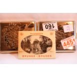 Two vintage stainless steel cigarette cases with maps of Europe and a set of Bruges snapshots. Not