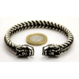 White metal Tibetan silver twisted rope effect bangle with dragon head finials. P&P Group 1 (£14+VAT