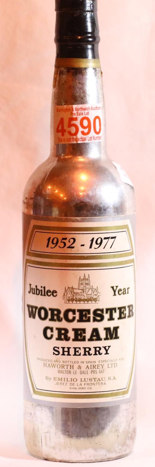 Bottle of 1977 Jubilee Worcester cream sherry in a silver bottle. Not available for in-house P&P