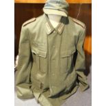 German WWII representation comprising badged wool tunic and M35 field cap. P&P Group 3 (£25+VAT
