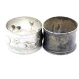 Indian silver relief decorated circular napkin ring, marked 75S, and a hallmarked silver napkin