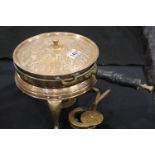 Eastern copper relief decorated warming pan, sitting on stand with burner. P&P Group 3 (£25+VAT