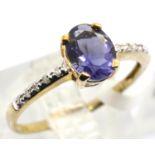 9ct gold tanzanite ring with diamond shoulders, size O, 1.7g. Condition report: Surface scratching